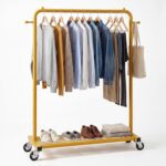 Sywhitta Clothes Rack on wheels, Clothing Rack with Bottom Mesh Storage Shelf,Sturdy Metal Frame,Rolling Garment Rack for Hanging Clothes,Coats,Skirts,39.76" L x 16" W x 64.56" H,Golden